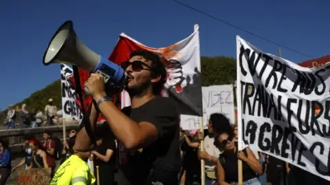 Countrywide Walkouts Begin Against Spending Slashing